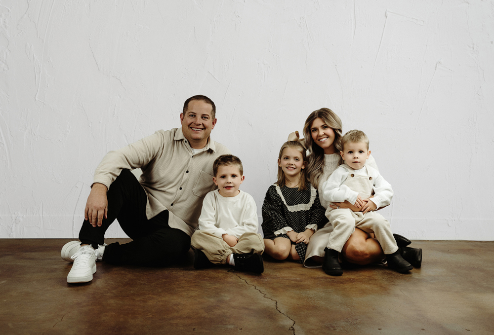 Relaxed, candid family portrait captured in Cedar Valley photography studio.