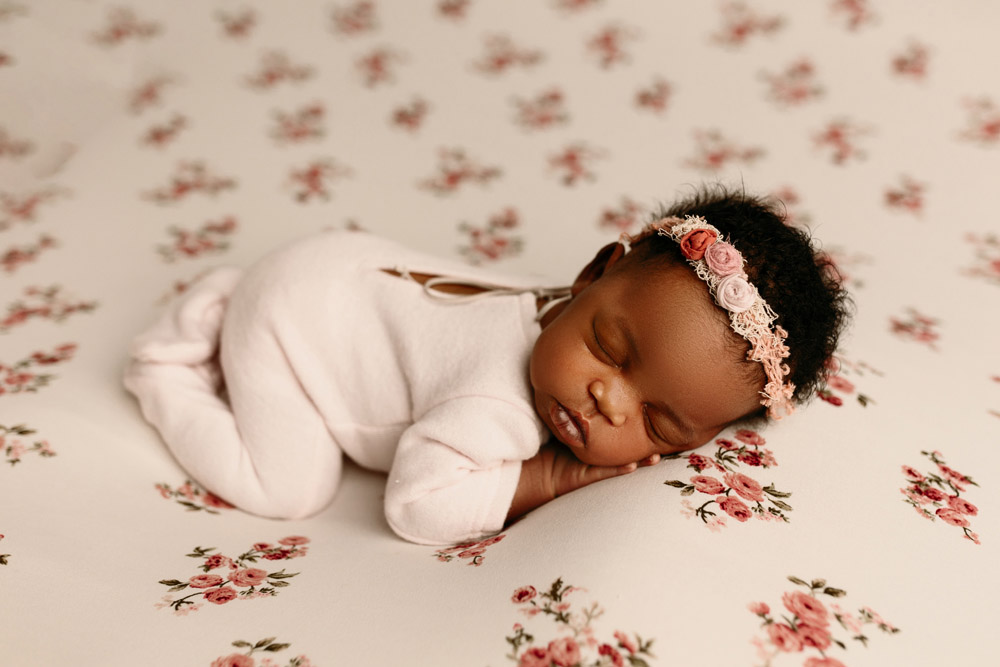 Sleeping newborn photo of baby Elsa during studio photography session in Cedar Falls Iowa