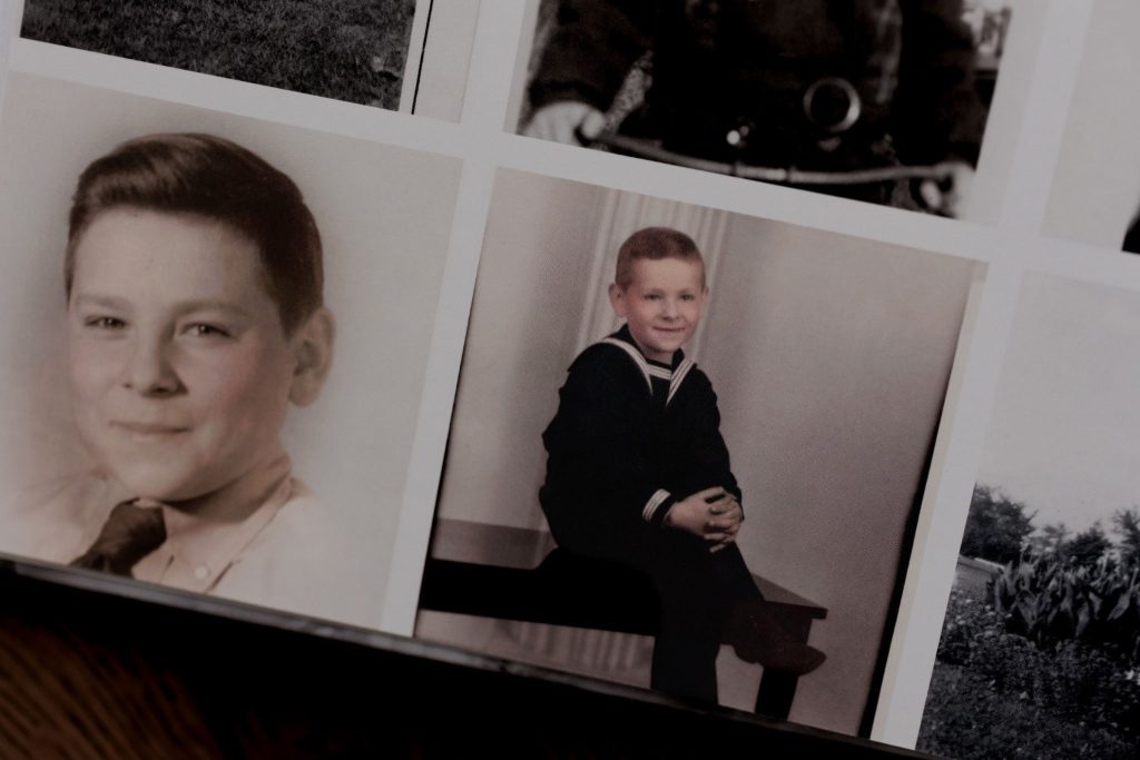 Side-by-side childhood portraits of grandfather as a young boy.