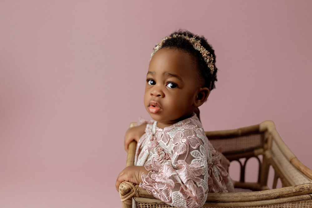Milestone photo of one year old baby Amy captured in Cedar Falls photography studio