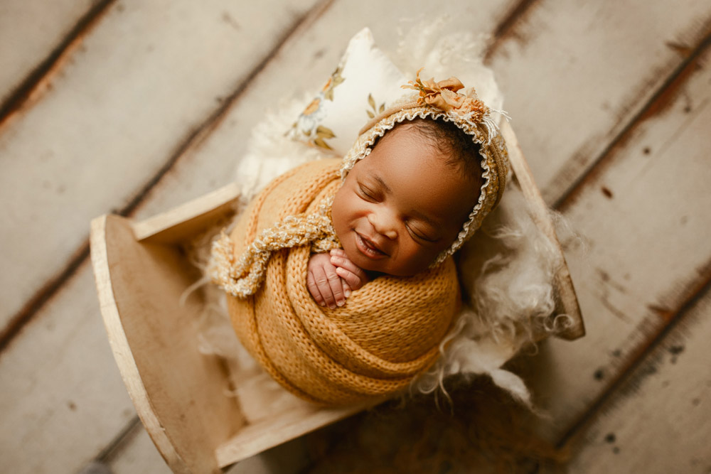 Newborn photo of baby Elsa swaddled and sleeping at Little Moments by Sarah in Cedar Falls Iowa