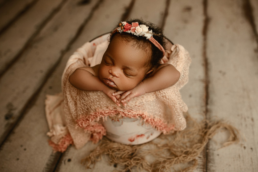 Newborn photo of baby Elsa swaddled and sleeping at Little Moments by Sarah in Cedar Falls Iowa