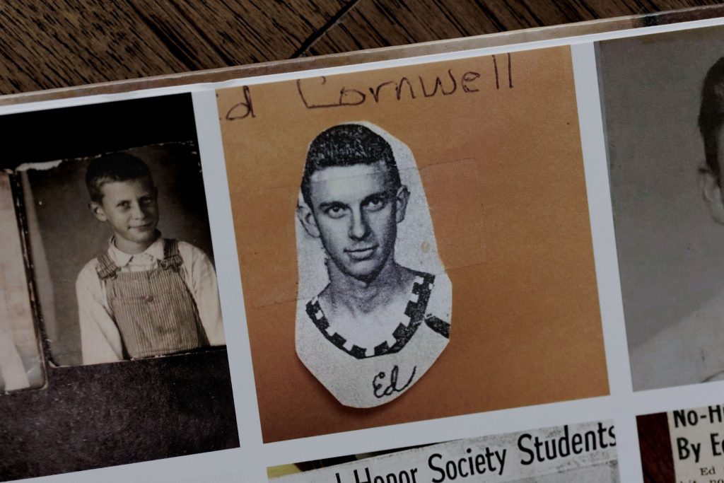 Scrapbook-style cutout of Grandpa Ed labeled with handwriting, displayed in a vintage photo album.